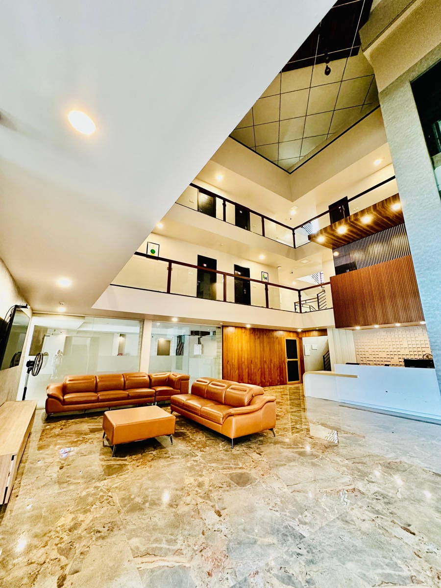 The elegant lobby of IGNIVA, widely regarded as the best luxury hotel near Calicut airport